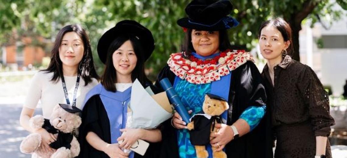 Graduation Photo of Yi Wang and Romalani Leofo