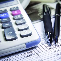 Accounting: calculator, pens, spreadsheet